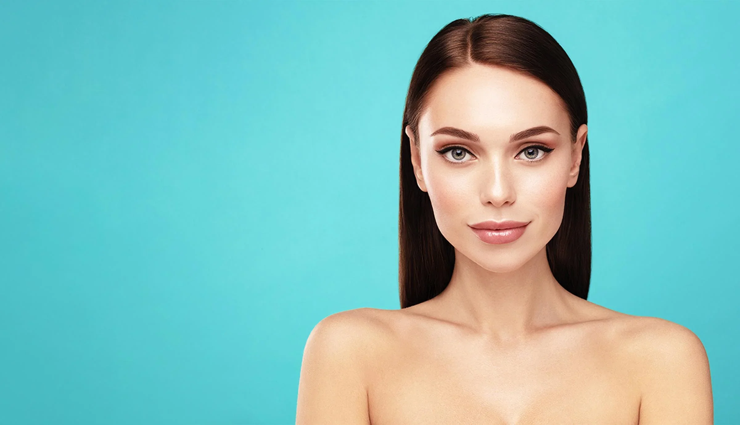 Woman with smooth, radiant skin and natural makeup against a teal backdrop